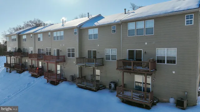 a view of a house with yard and sitting area
