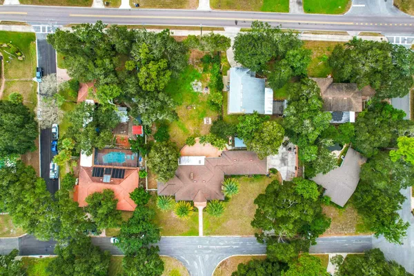 an aerial view of a house with swimming pool garden and outdoor seating