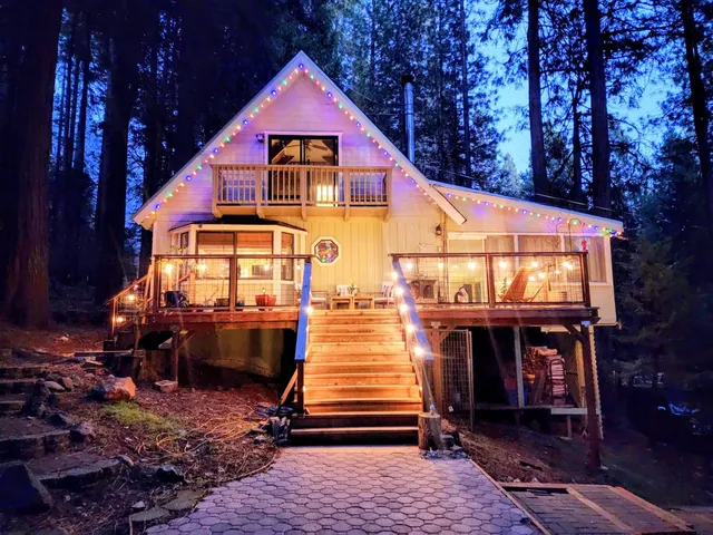 a kitchen with cabinets window and white appliances