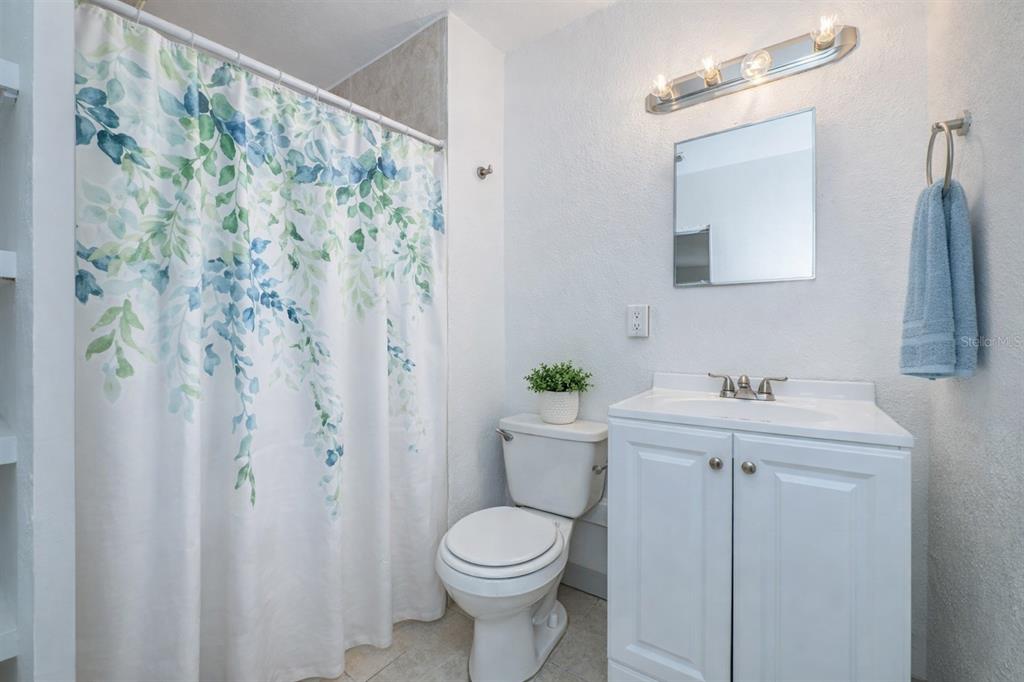 6027 Illinois Avenue New Port Richey, FL 34653 - Photo 12 of 30 a bathroom with a sink and toilet