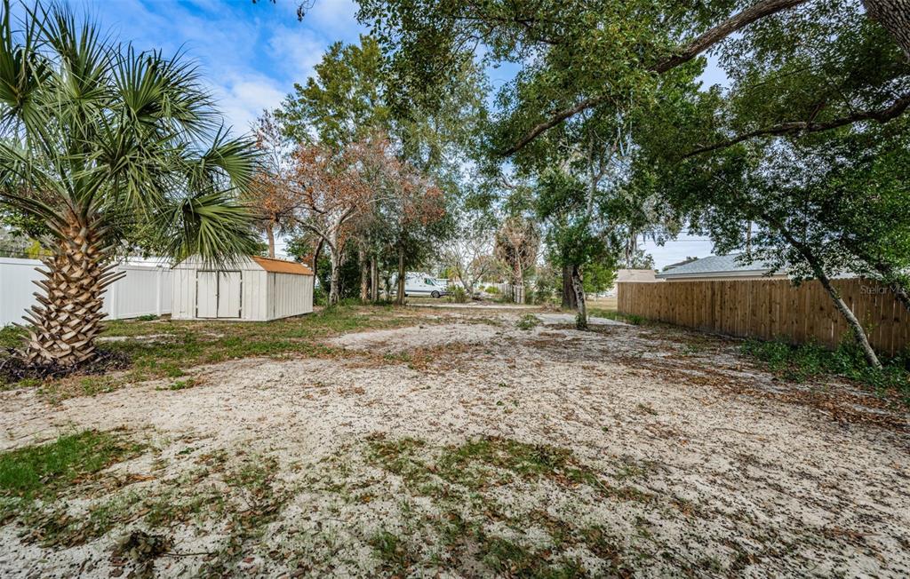 6027 Illinois Avenue New Port Richey, FL 34653 - Photo 14 of 30 a view of a house with a back yard