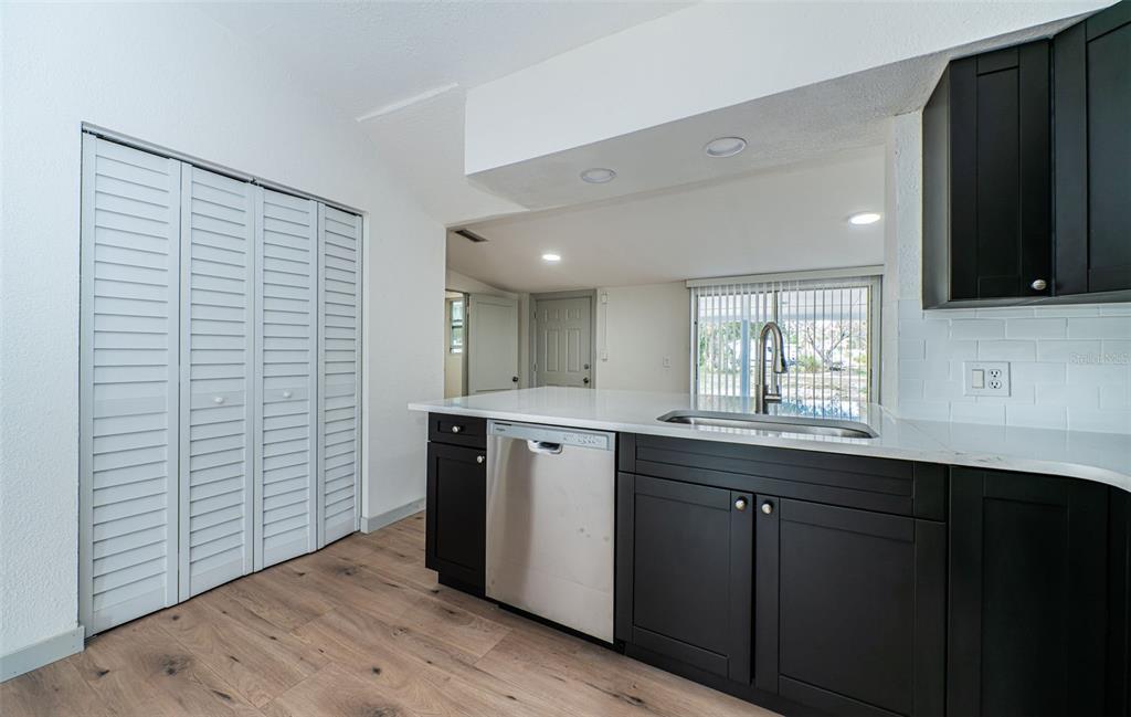 6027 Illinois Avenue New Port Richey, FL 34653 - Photo 18 of 30 a kitchen with a sink and cabinets