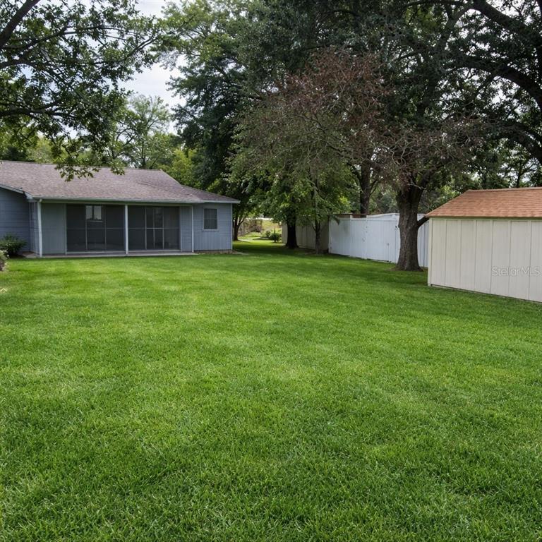 6027 Illinois Avenue New Port Richey, FL 34653 - Photo 27 of 30 a front view of a house with garden
