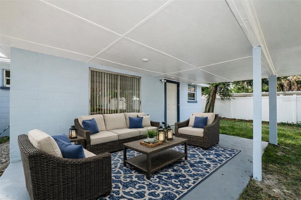 6027 Illinois Avenue New Port Richey, FL 34653 - Photo 30 of 30 a living room with furniture and a rug