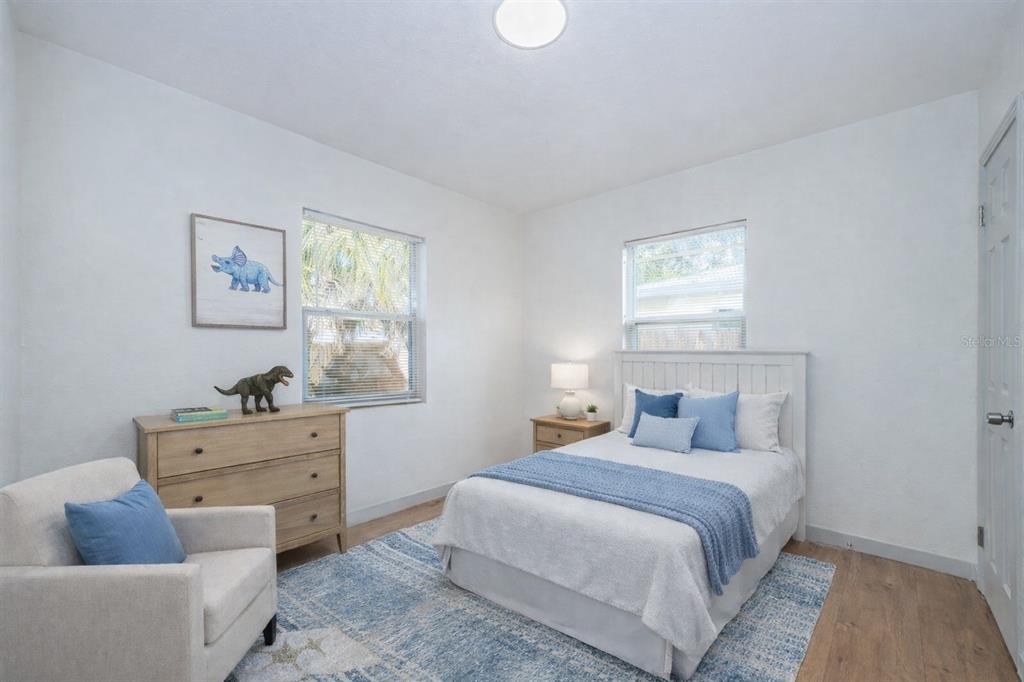 6027 Illinois Avenue New Port Richey, FL 34653 - Photo 10 of 30 a bedroom with a bed and window