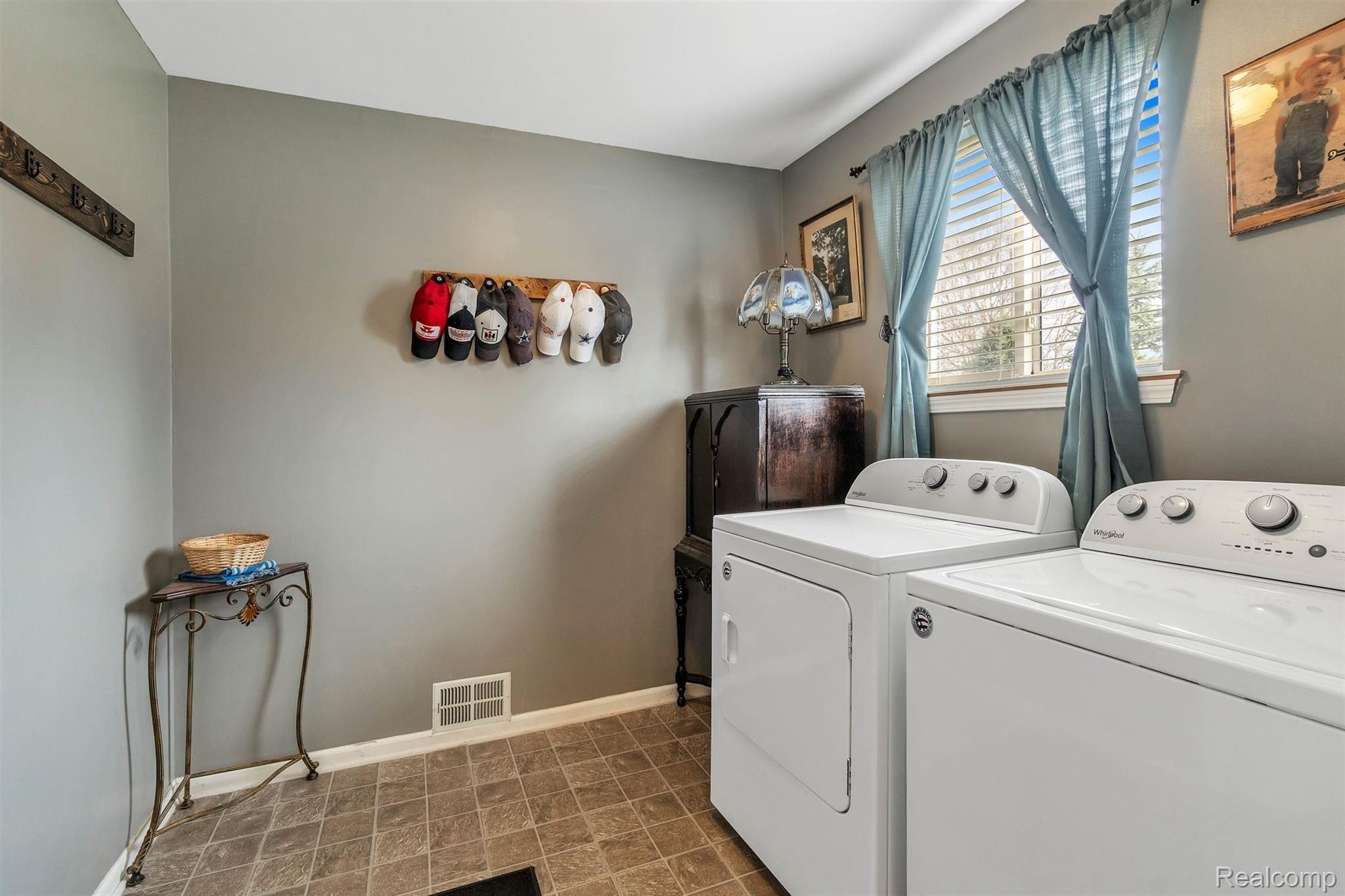 10893 Converse Road Fowlerville, MI 48836 - Photo 8 of 38 First Floor Laundry with newer washer and dryer
