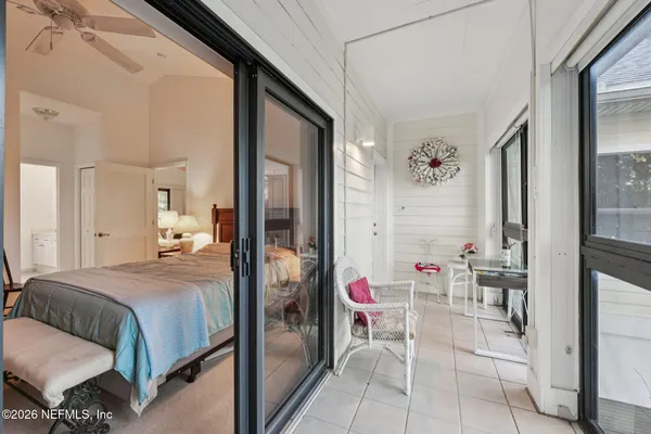 a bedroom with a bed furniture and a book shelf