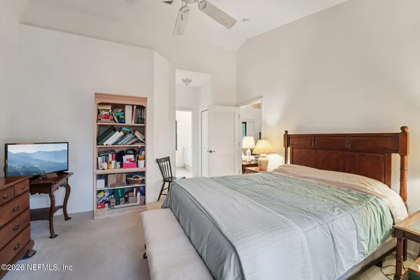 a bathroom with a double vanity sink mirror and shower
