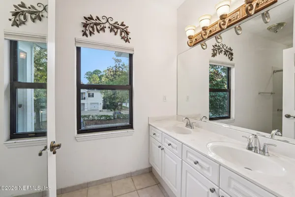 a bathroom with a shower a toilet and a sink