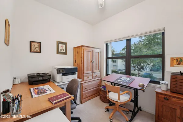 a bathroom with a sink a toilet and shower curtain