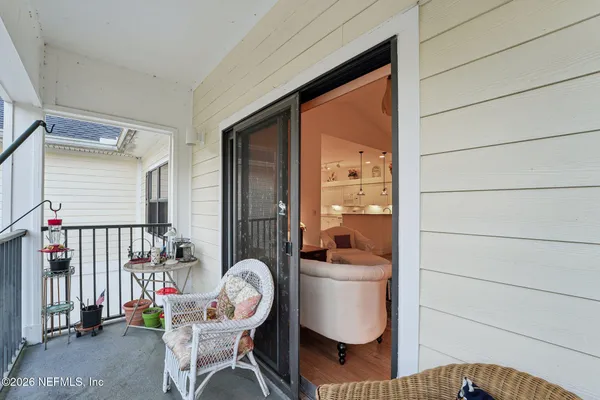 a view of a porch with furniture