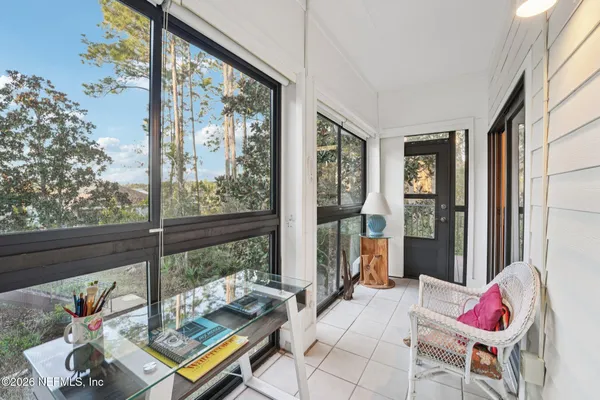 a bedroom with furniture and a window