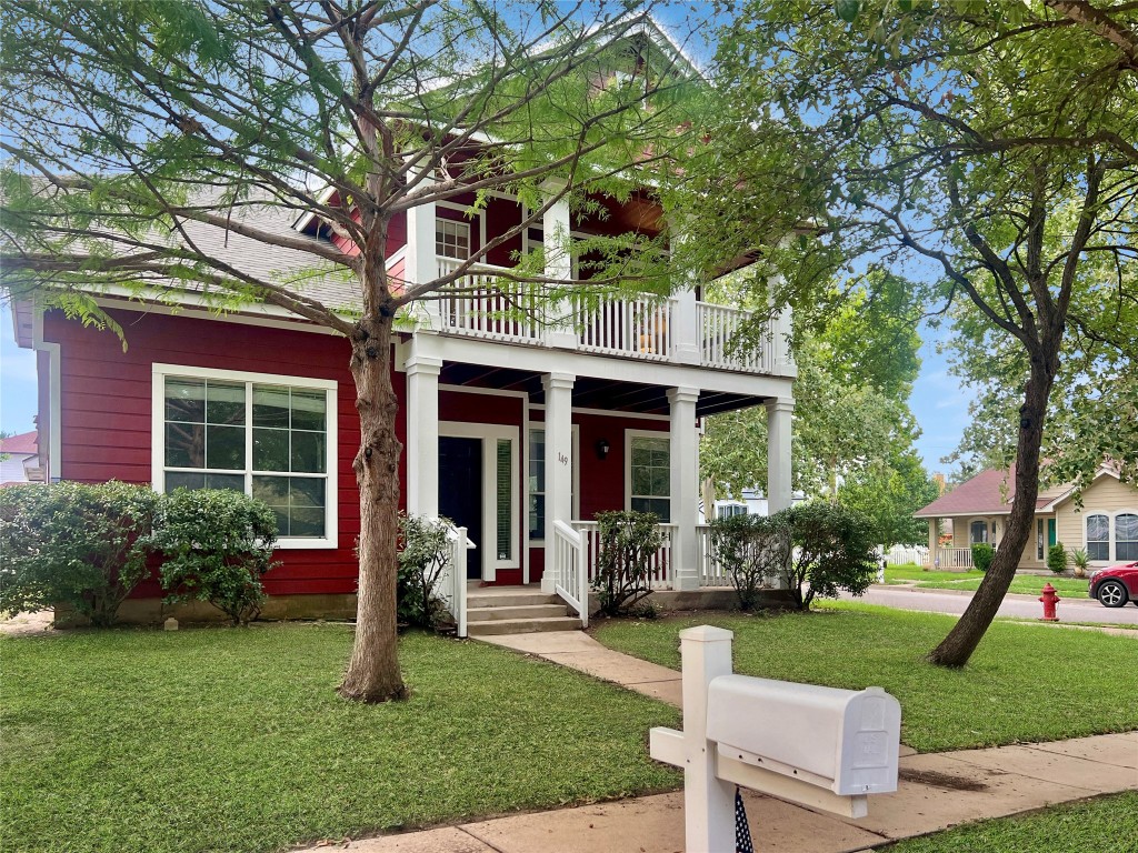 a front view of a house with garden and porch