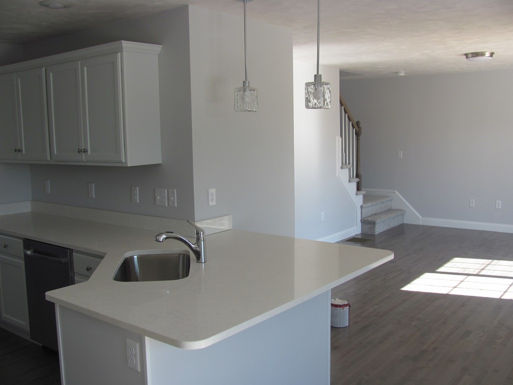 14 Murray Road Ashburnham, MA 01430 - Photo 5 of 15 a kitchen with a sink a refrigerator and cabinets