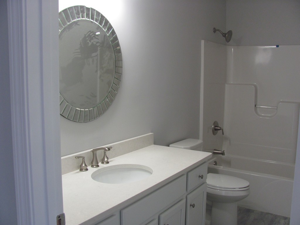 14 Murray Road Ashburnham, MA 01430 - Photo 10 of 15 a bathroom with a sink toilet and a mirror