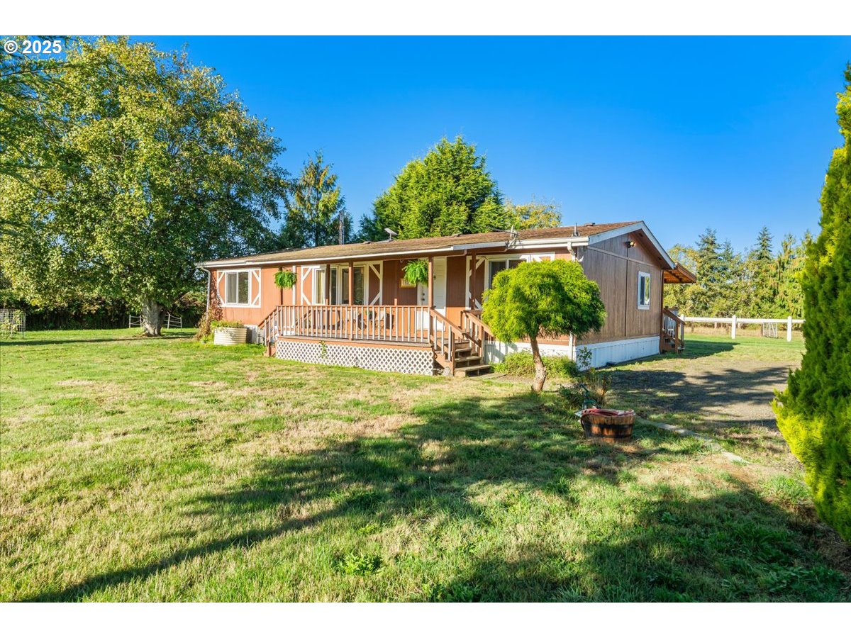 78527 Point Adams Road Clatskanie, OR 97016 - Photo 11 of 46 a view of a house with a yard
