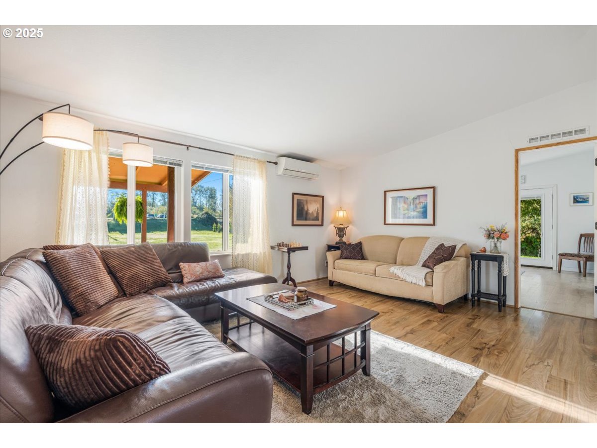 78527 Point Adams Road Clatskanie, OR 97016 - Photo 14 of 46 a living room with furniture and a large window