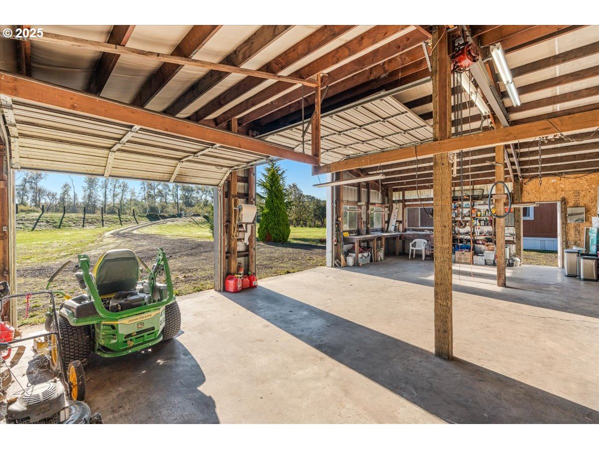 78527 Point Adams Road Clatskanie, OR 97016 - Photo 33 of 46 a view of a patio with table and chairs potted plants with wooden floor