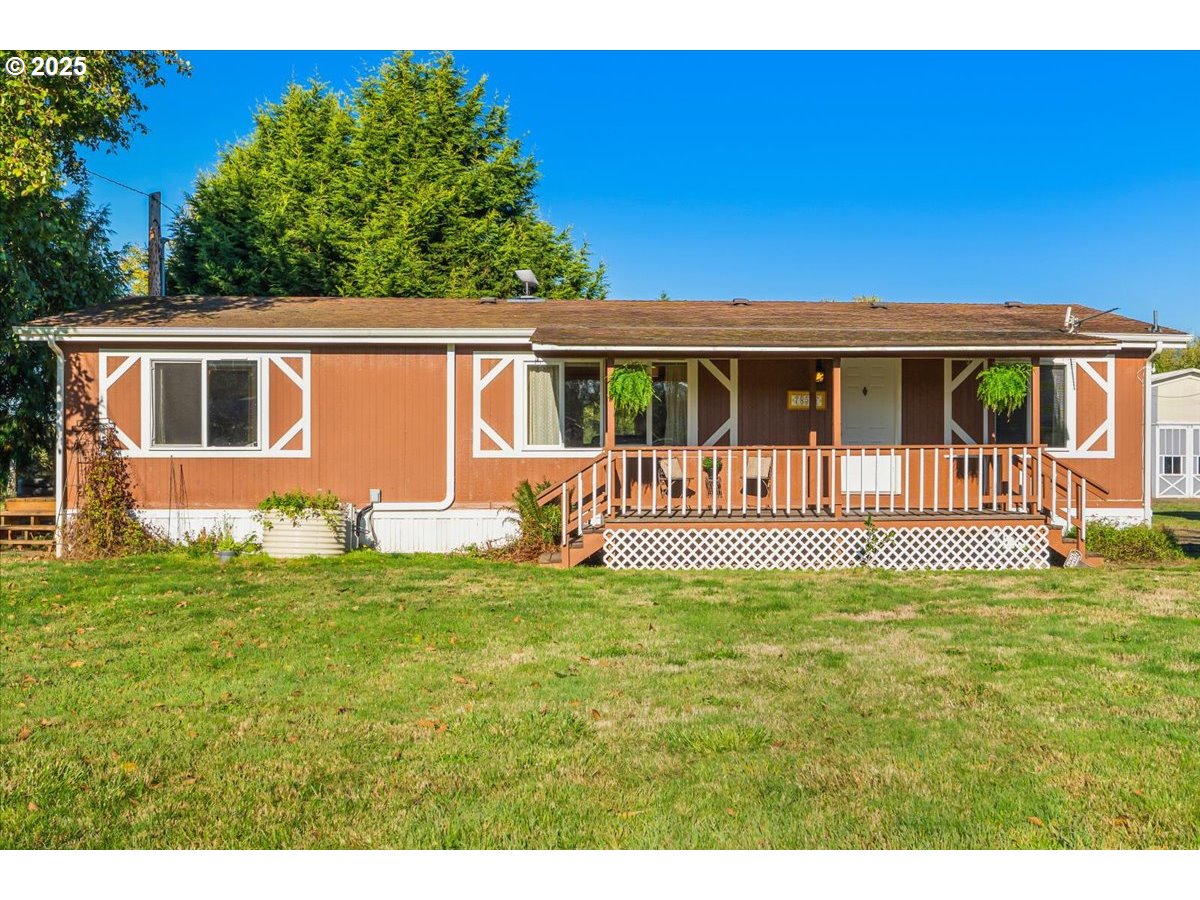78527 Point Adams Road Clatskanie, OR 97016 - Photo 9 of 46 a front view of a house with a garden