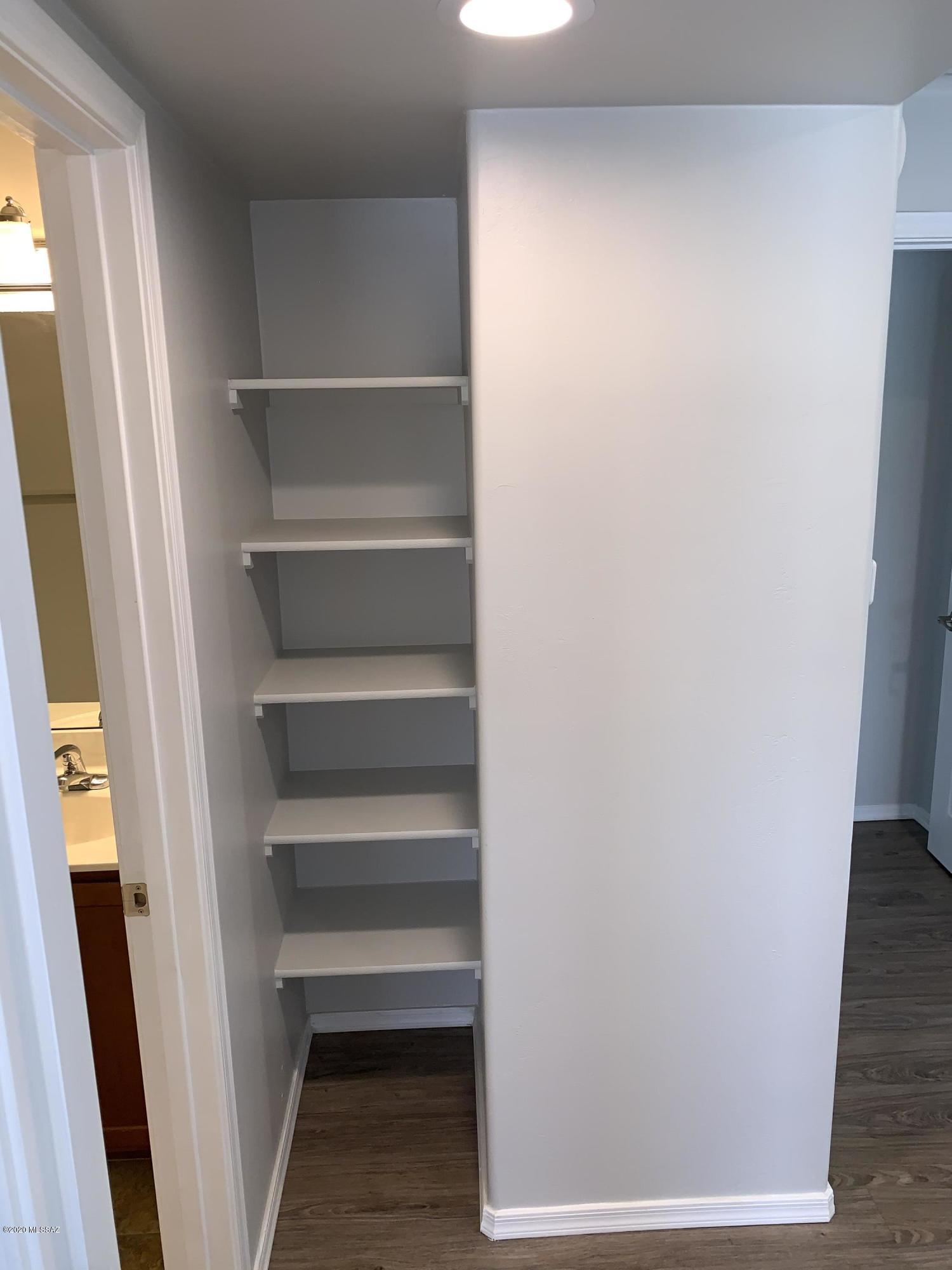 4181 North Fortune Loop Tucson, AZ 85719 - Photo 22 of 39 a view of walk in closet with empty racks