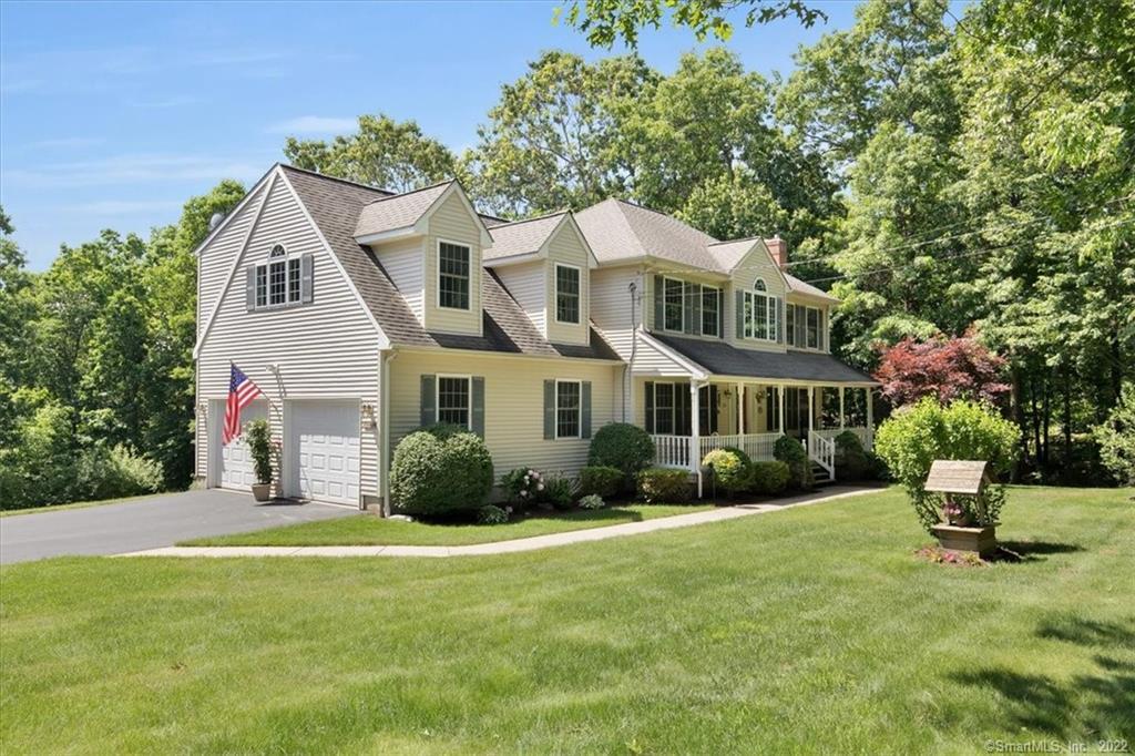 133 Dockerel Road Tolland, CT 06084 - Photo 1 of 1 a front view of a house with a yard