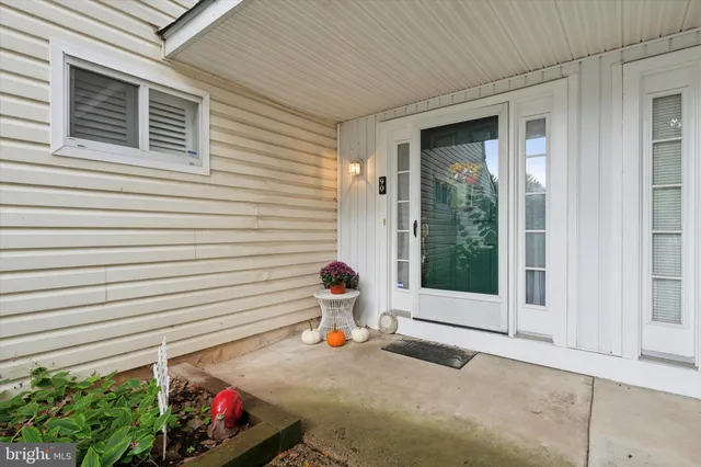a view of a porch with a bench