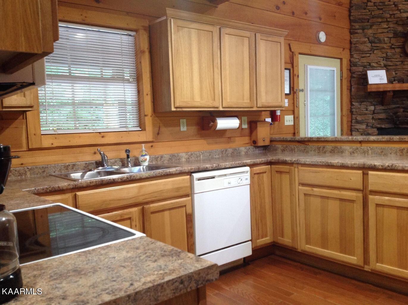 315 Windrock Road Oliver Springs, TN 37840 - Photo 13 of 36 a kitchen with stainless steel appliances granite countertop a sink stove and cabinets