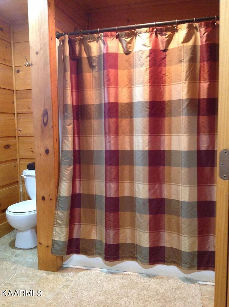 315 Windrock Road Oliver Springs, TN 37840 - Photo 14 of 36 a bathroom with a shower and a toilet