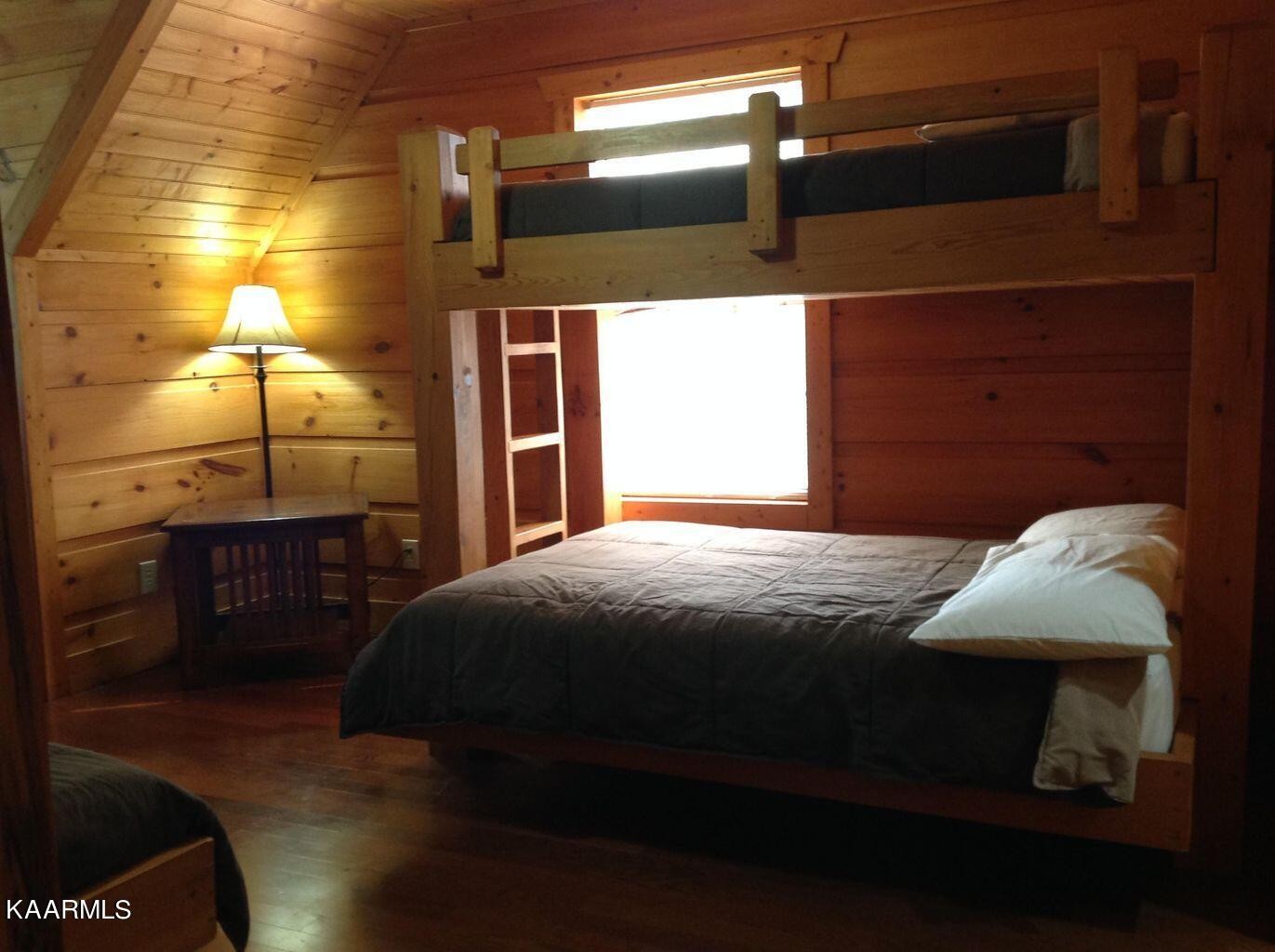 315 Windrock Road Oliver Springs, TN 37840 - Photo 22 of 36 a bedroom with a bed and a night stand