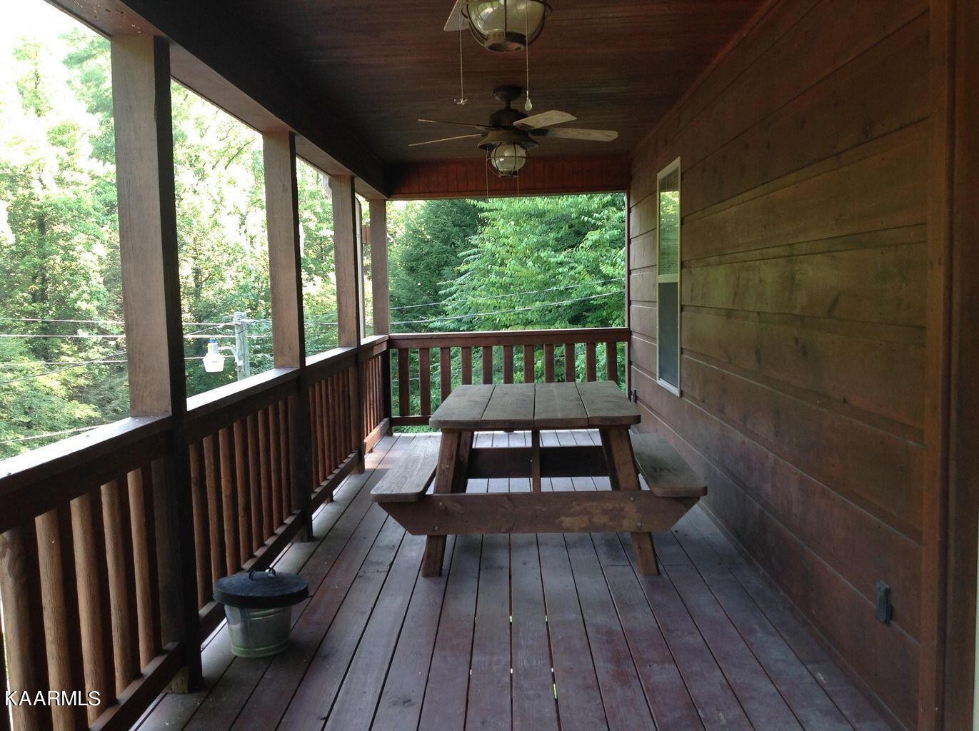 315 Windrock Road Oliver Springs, TN 37840 - Photo 25 of 36 a view of a two chairs in the balcony
