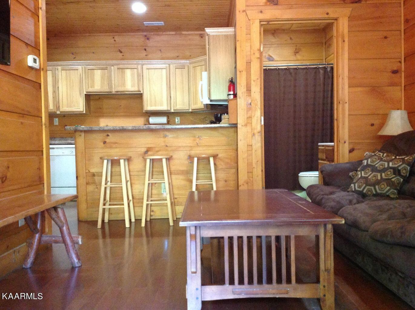 315 Windrock Road Oliver Springs, TN 37840 - Photo 27 of 36 a living room with furniture and a table
