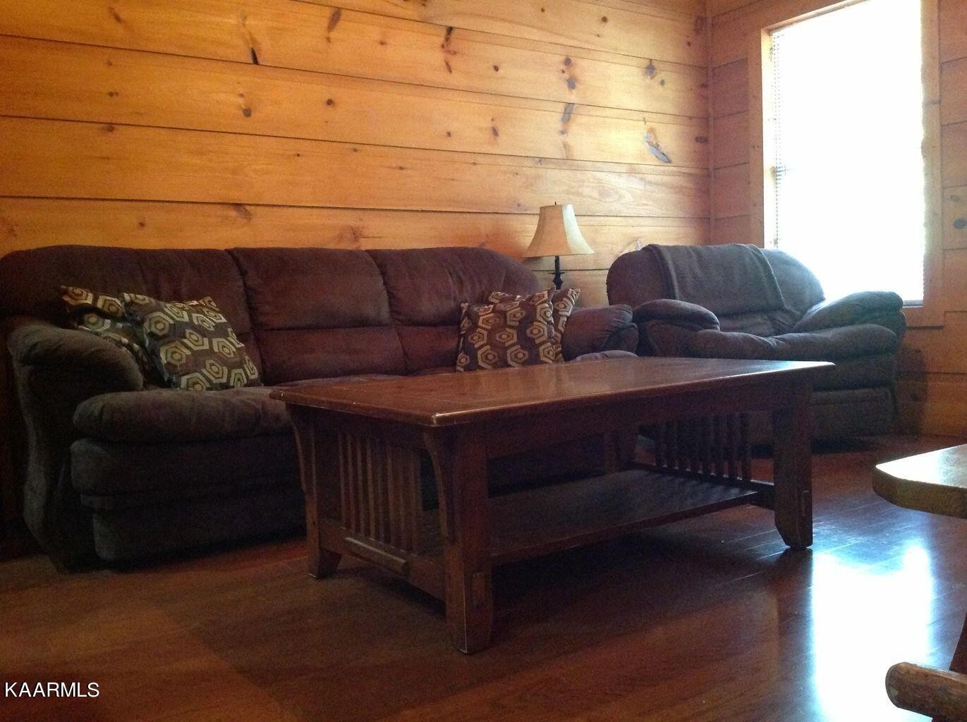 315 Windrock Road Oliver Springs, TN 37840 - Photo 28 of 36 a living room with furniture and a potted plant