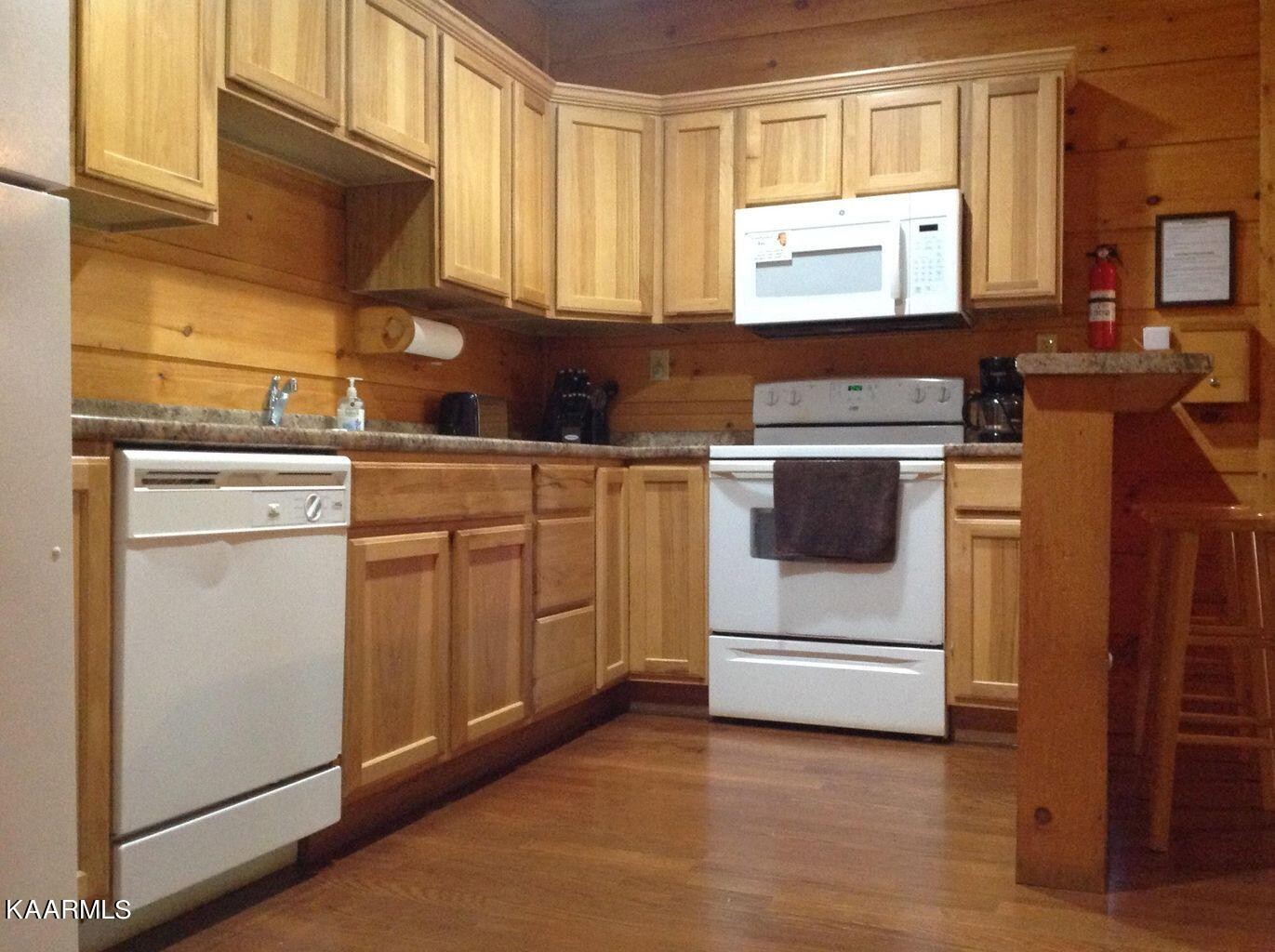 315 Windrock Road Oliver Springs, TN 37840 - Photo 30 of 36 a kitchen with appliances a sink and cabinets