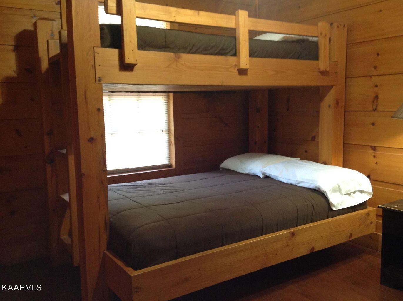 315 Windrock Road Oliver Springs, TN 37840 - Photo 34 of 36 a bed sitting in a bedroom next to a window