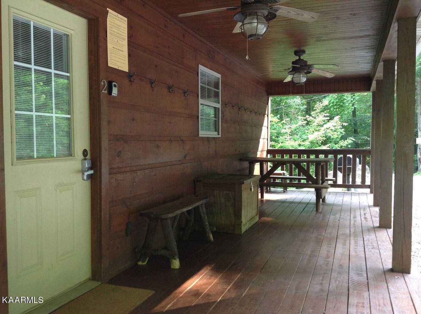315 Windrock Road Oliver Springs, TN 37840 - Photo 5 of 36 a view of a porch with a table and chairs