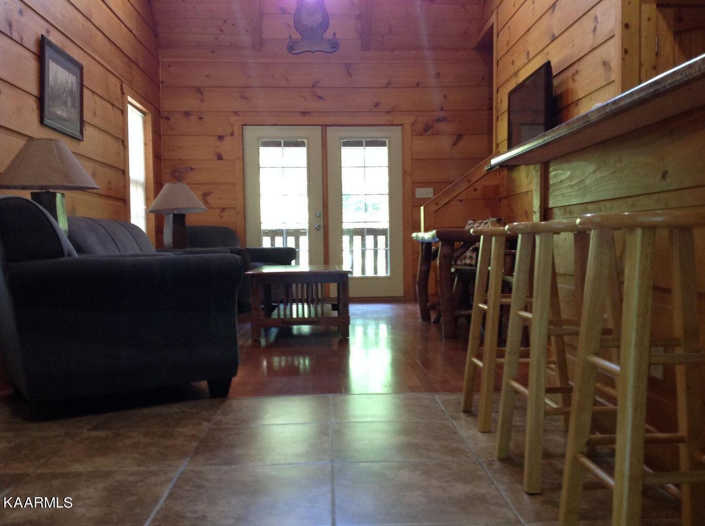 315 Windrock Road Oliver Springs, TN 37840 - Photo 8 of 36 a living room with lots of furniture and a rug