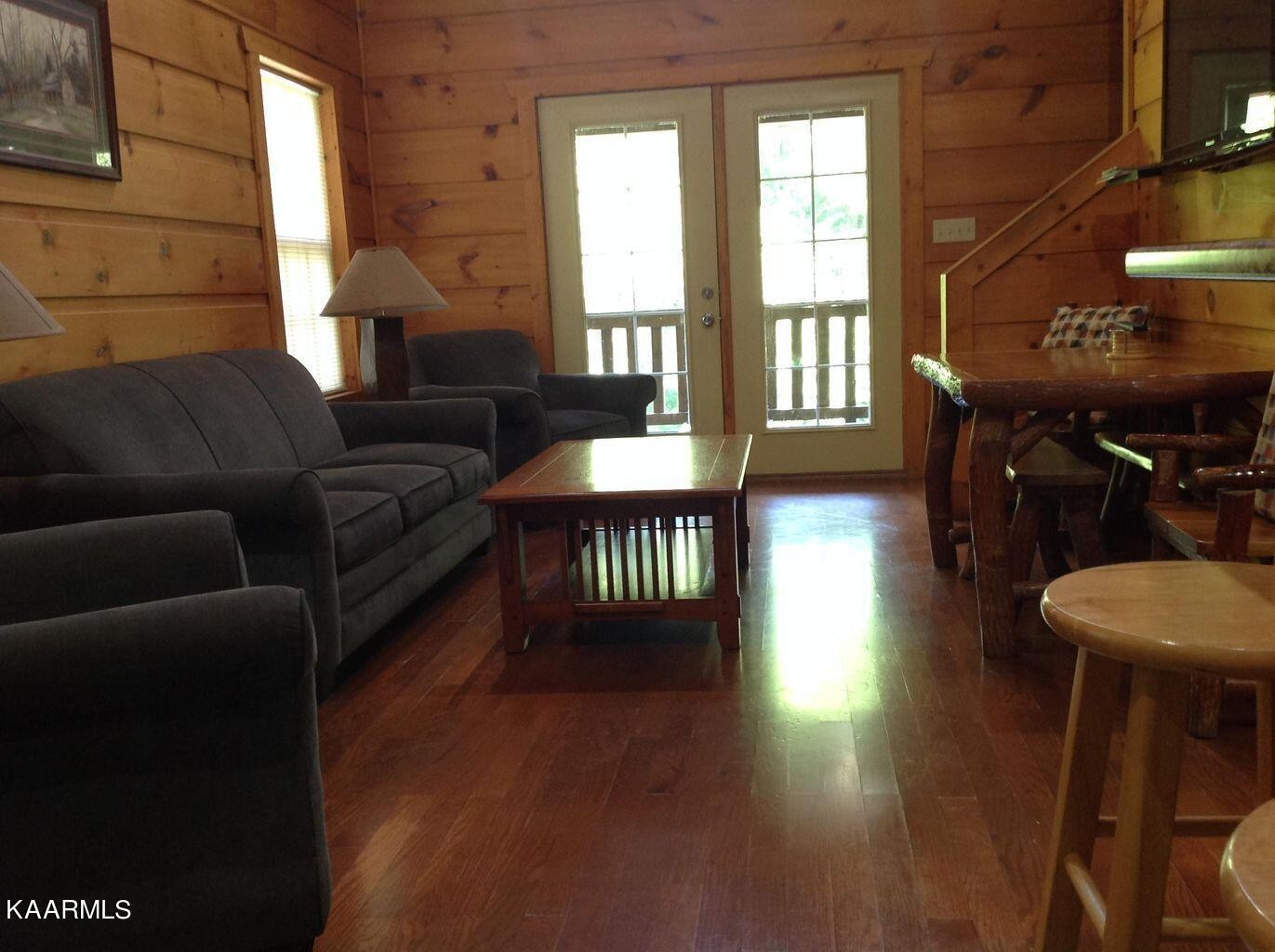 315 Windrock Road Oliver Springs, TN 37840 - Photo 9 of 36 a living room with furniture and a wooden floor