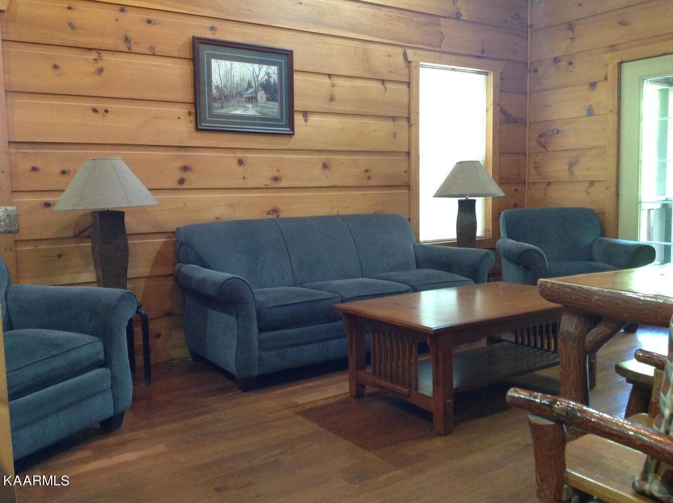 315 Windrock Road Oliver Springs, TN 37840 - Photo 10 of 36 a living room with furniture and a window