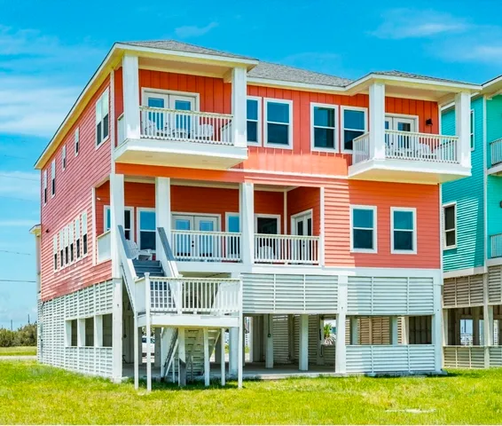a front view of a building with a yard