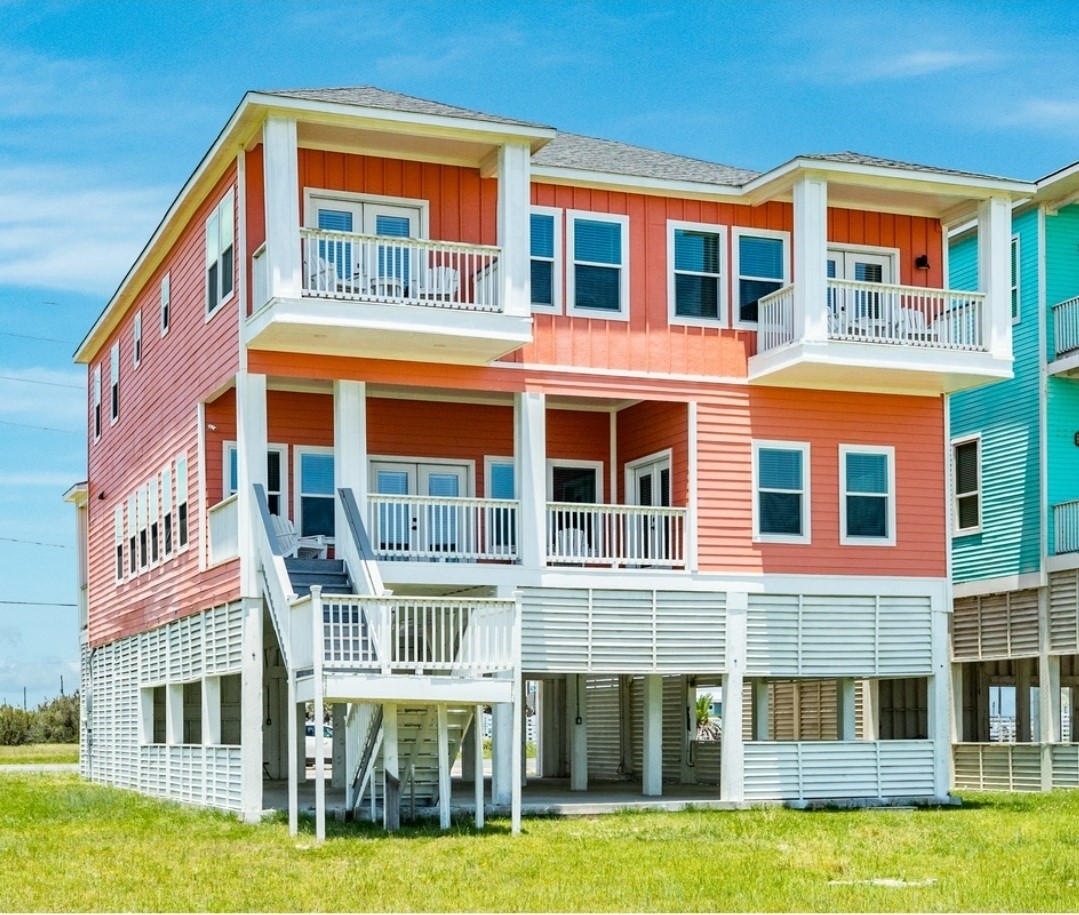 a front view of a building with a yard