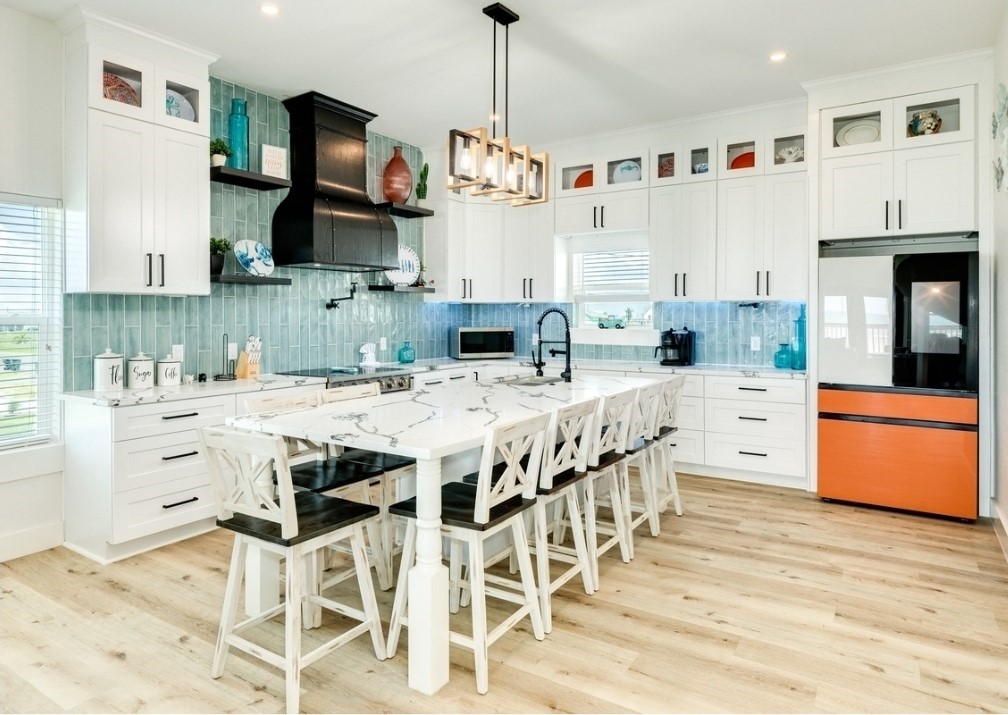23245 Termini-San Luis Pass Road Galveston, TX 77554 - Photo 12 of 45 a kitchen with stainless steel appliances kitchen island granite countertop a sink and cabinets