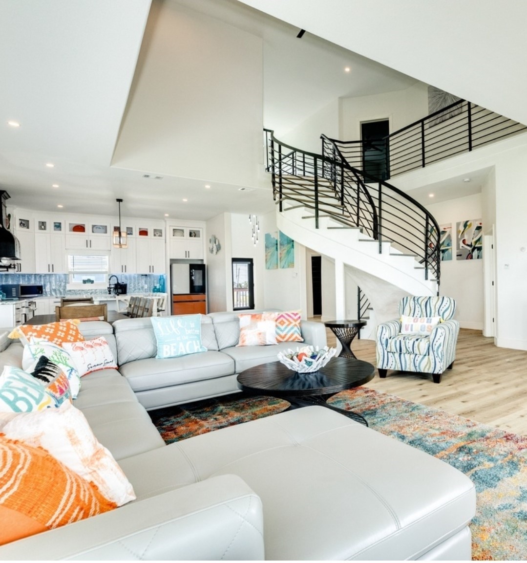 23245 Termini-San Luis Pass Road Galveston, TX 77554 - Photo 16 of 45 a living room with furniture and a chandelier