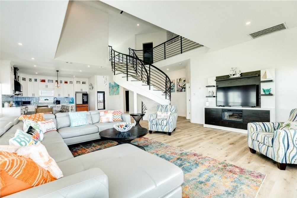 23245 Termini-San Luis Pass Road Galveston, TX 77554 - Photo 17 of 45 a living room with furniture and a flat screen tv