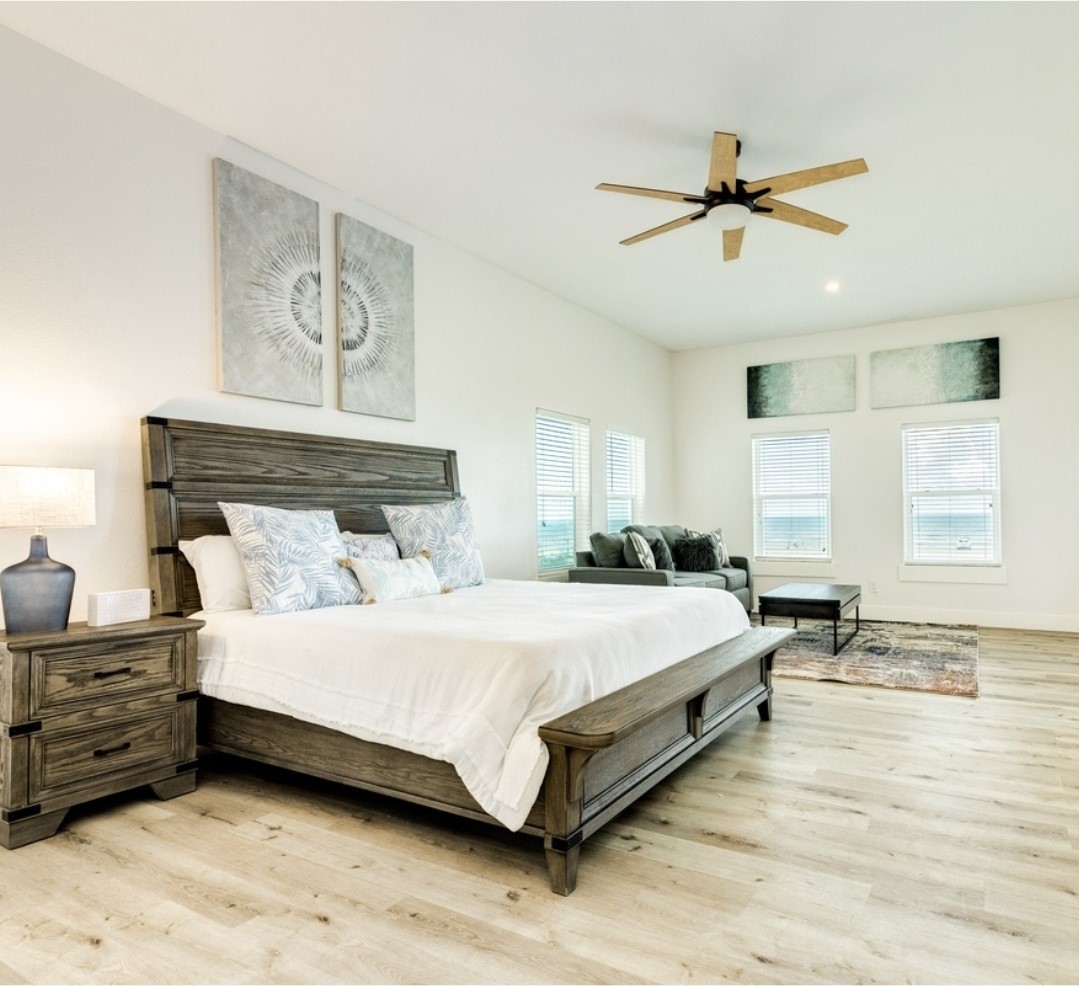 23245 Termini-San Luis Pass Road Galveston, TX 77554 - Photo 27 of 45 a bedroom with a bed a window and closet