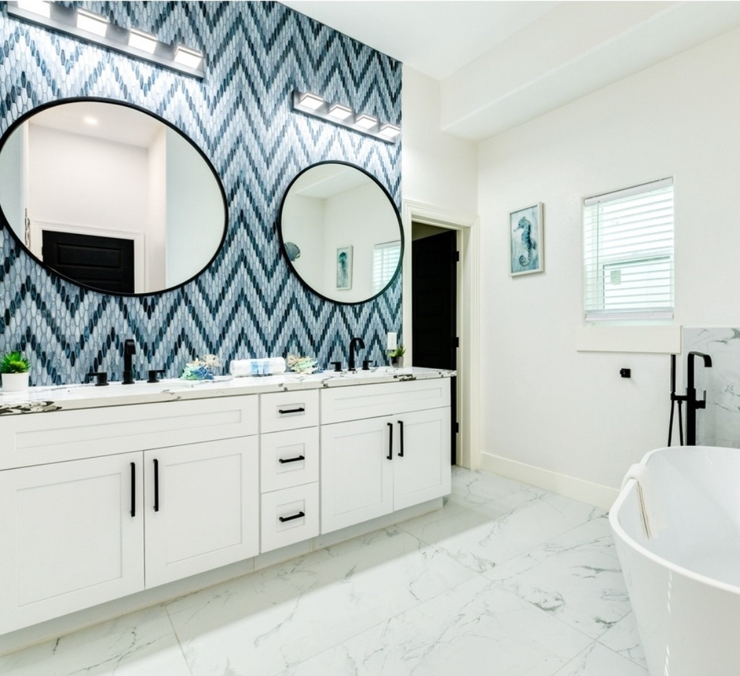 23245 Termini-San Luis Pass Road Galveston, TX 77554 - Photo 31 of 45 a bathroom with a granite countertop sink and a mirror