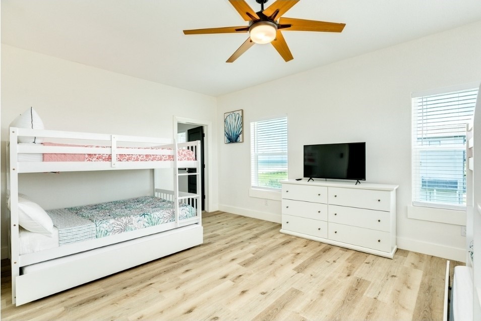 23245 Termini-San Luis Pass Road Galveston, TX 77554 - Photo 35 of 45 a room with a bed and a flat screen tv