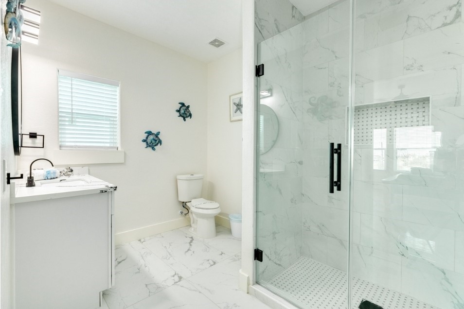23245 Termini-San Luis Pass Road Galveston, TX 77554 - Photo 37 of 45 a bathroom with a sink toilet and shower