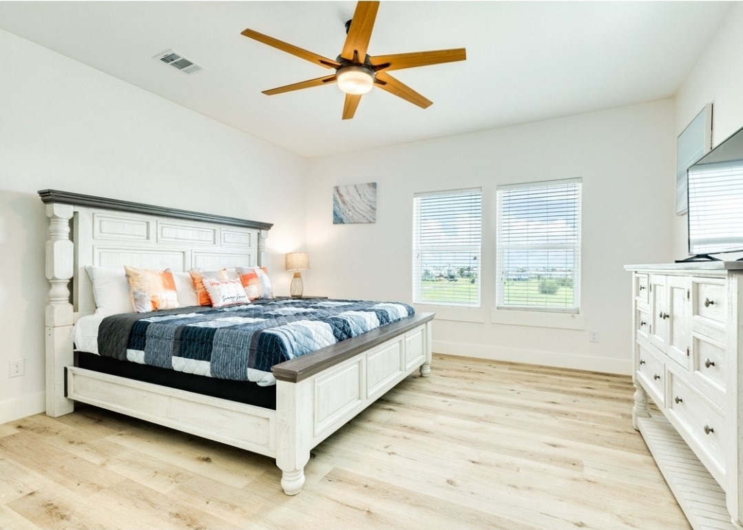 23245 Termini-San Luis Pass Road Galveston, TX 77554 - Photo 40 of 45 a bedroom with a bed and a window