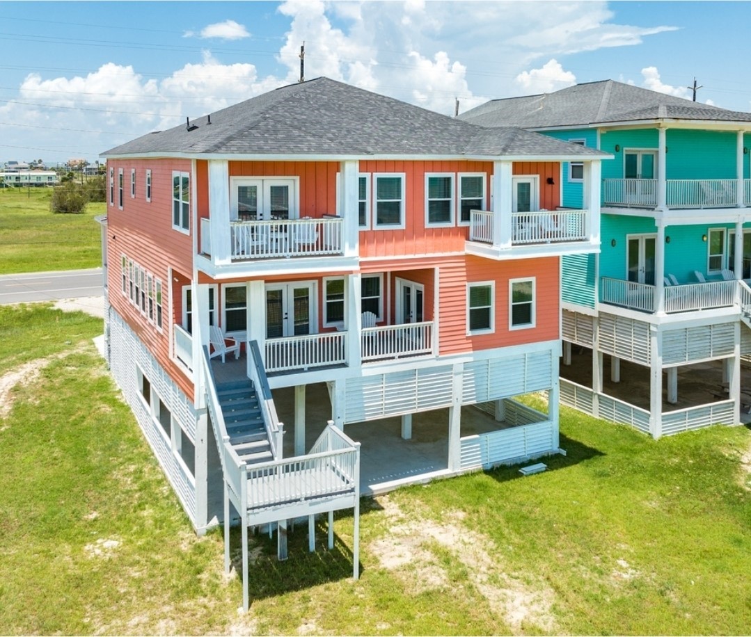 23245 Termini-San Luis Pass Road Galveston, TX 77554 - Photo 4 of 45 a front view of a house with a yard