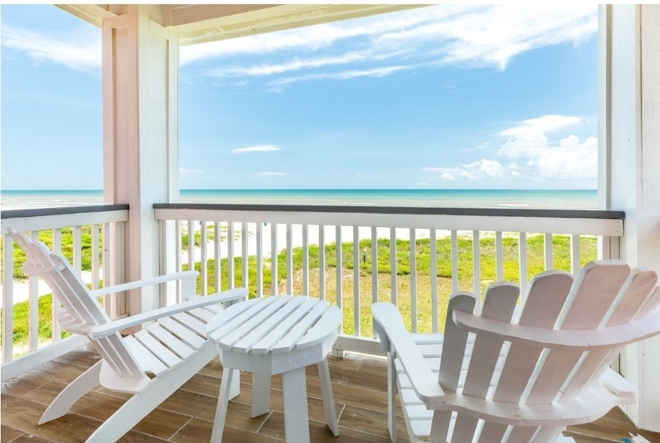 23245 Termini-San Luis Pass Road Galveston, TX 77554 - Photo 6 of 45 a view of a dining room with furniture a chandelier and wooden floor